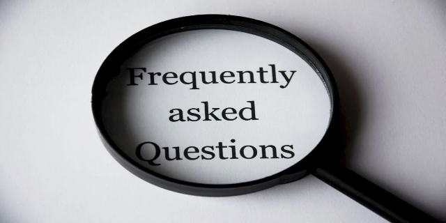 Frequently Asked Questions Text Inside Magnifing Glass